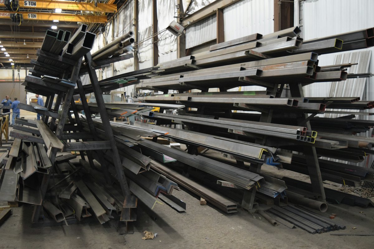 Lengths of steel stacked in a shed (illustrative stock photo)